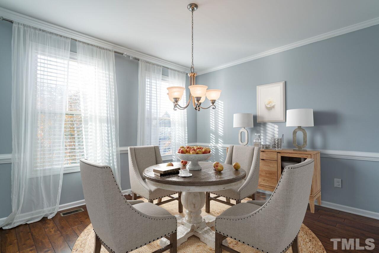 1323 Rodessa Run Raleigh, NC 27607 - Photo 13 of 29 a view of a dining room with furniture window and wooden floor