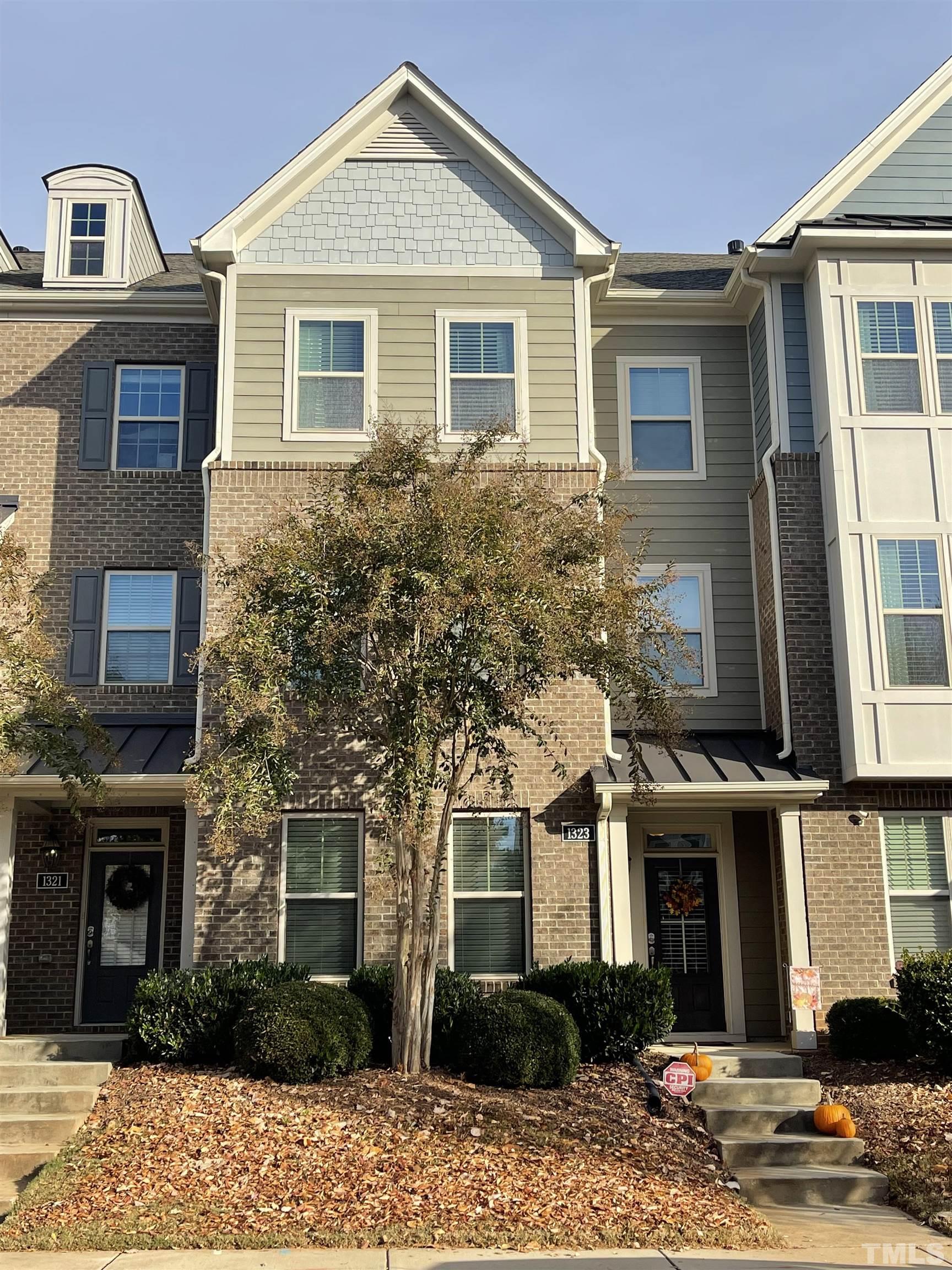 1323 Rodessa Run Raleigh, NC 27607 - Photo 2 of 29 a front view of a house with a yard