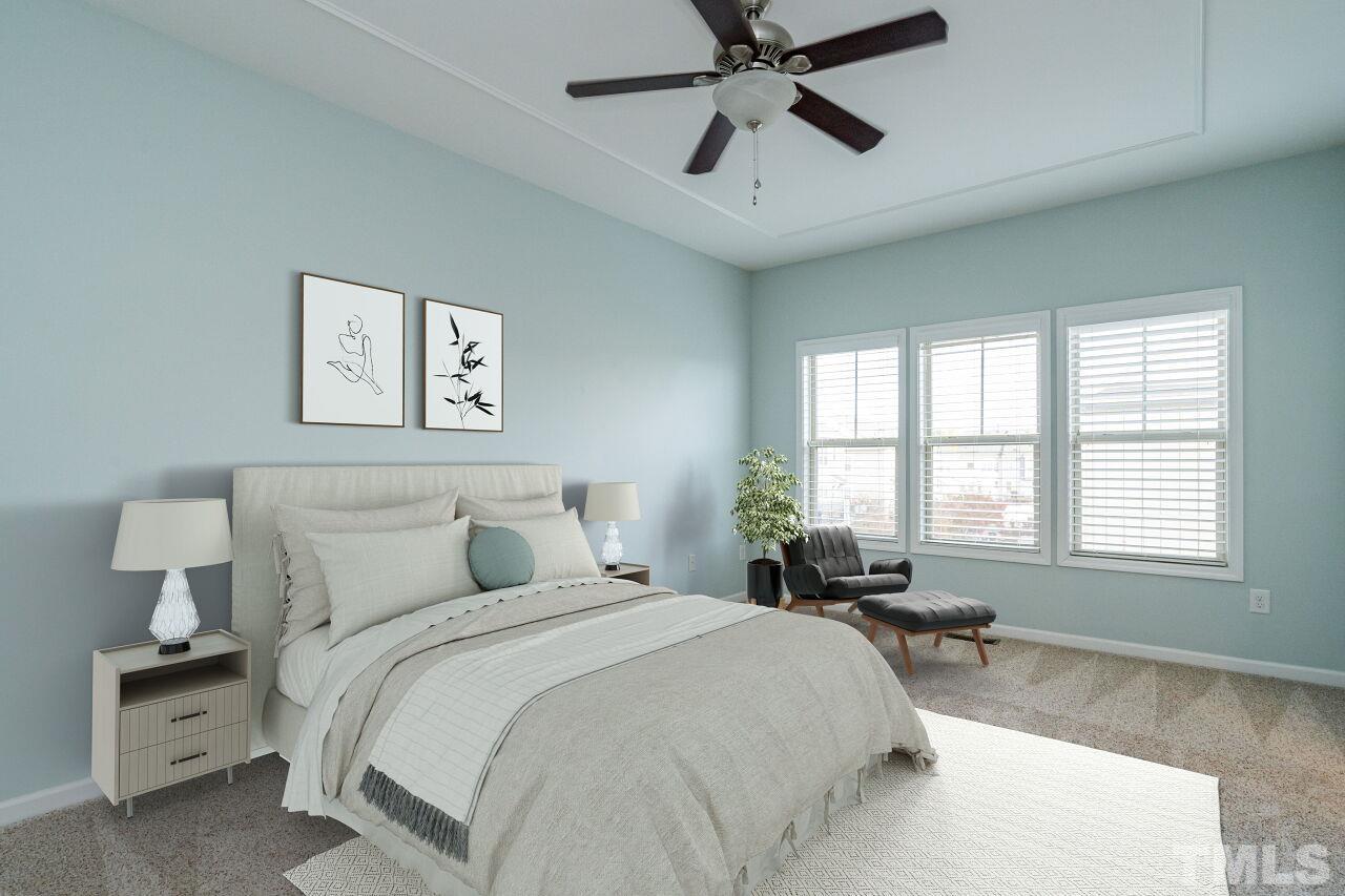 1323 Rodessa Run Raleigh, NC 27607 - Photo 21 of 29 a bedroom with a bed and painting on the wall