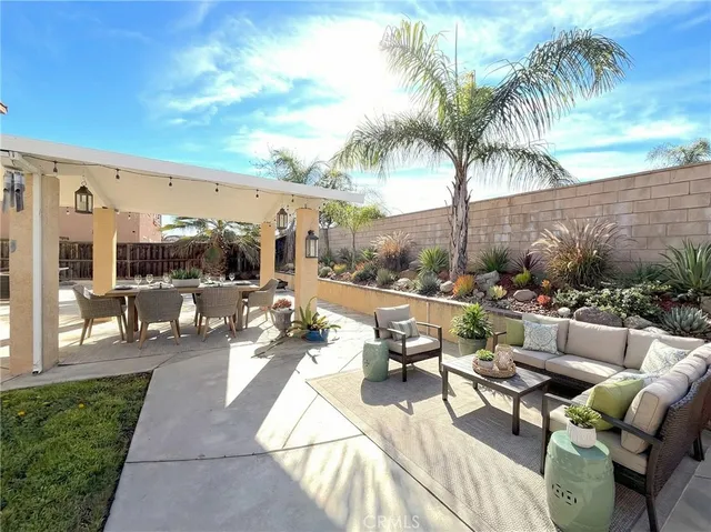 a view of swimming pool with outdoor seating and plants