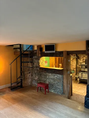 a living room with fireplace furniture and a flat screen tv