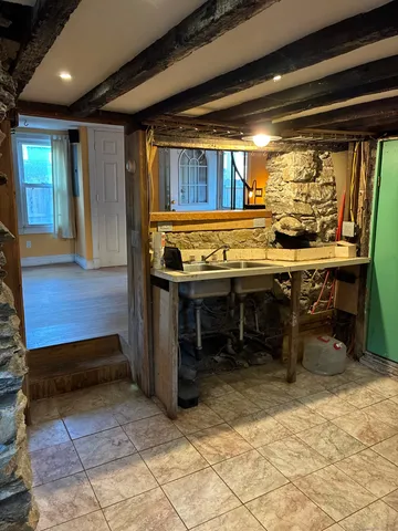 a view of a room with wooden furniture