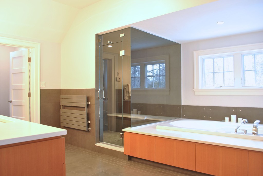 60 Oak Road Concord, MA 01742 - Photo 19 of 24 a bathroom with a tub sink and a mirror