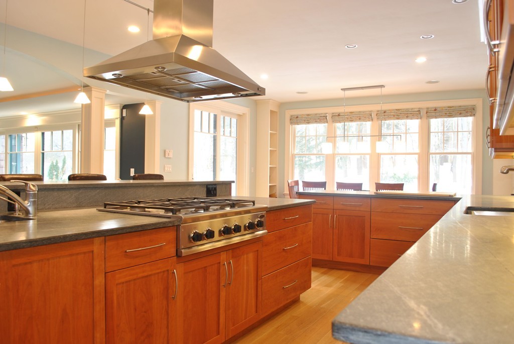 60 Oak Road Concord, MA 01742 - Photo 5 of 24 a large kitchen with stainless steel appliances granite countertop a stove and a sink