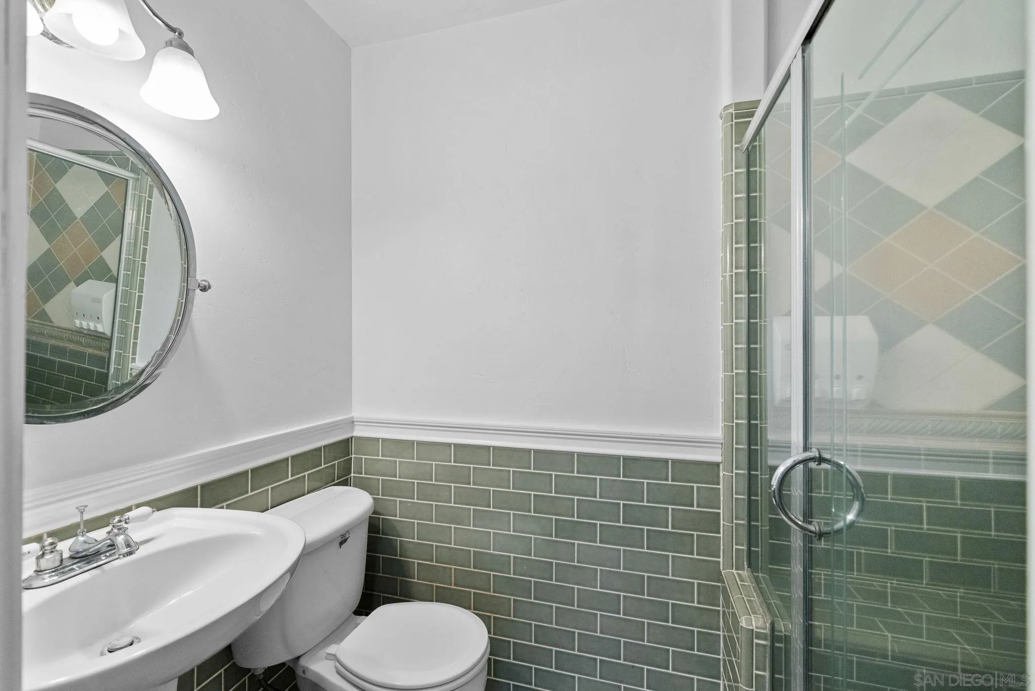 11507 Pinehurst Drive Lakeside, CA 92040 - Photo 11 of 25 a bathroom with a toilet a sink and mirror
