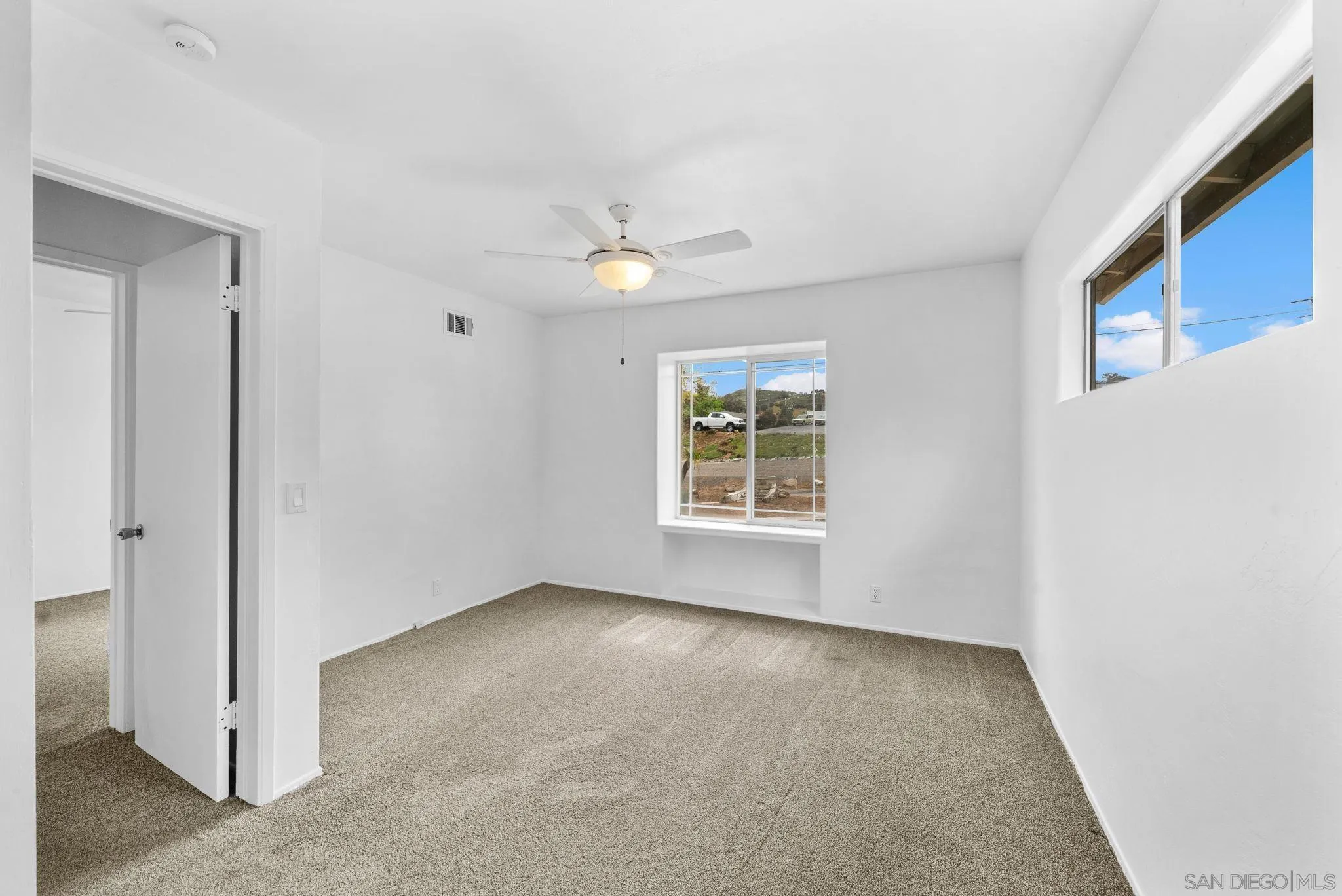 11507 Pinehurst Drive Lakeside, CA 92040 - Photo 16 of 25 an empty room with windows and fan