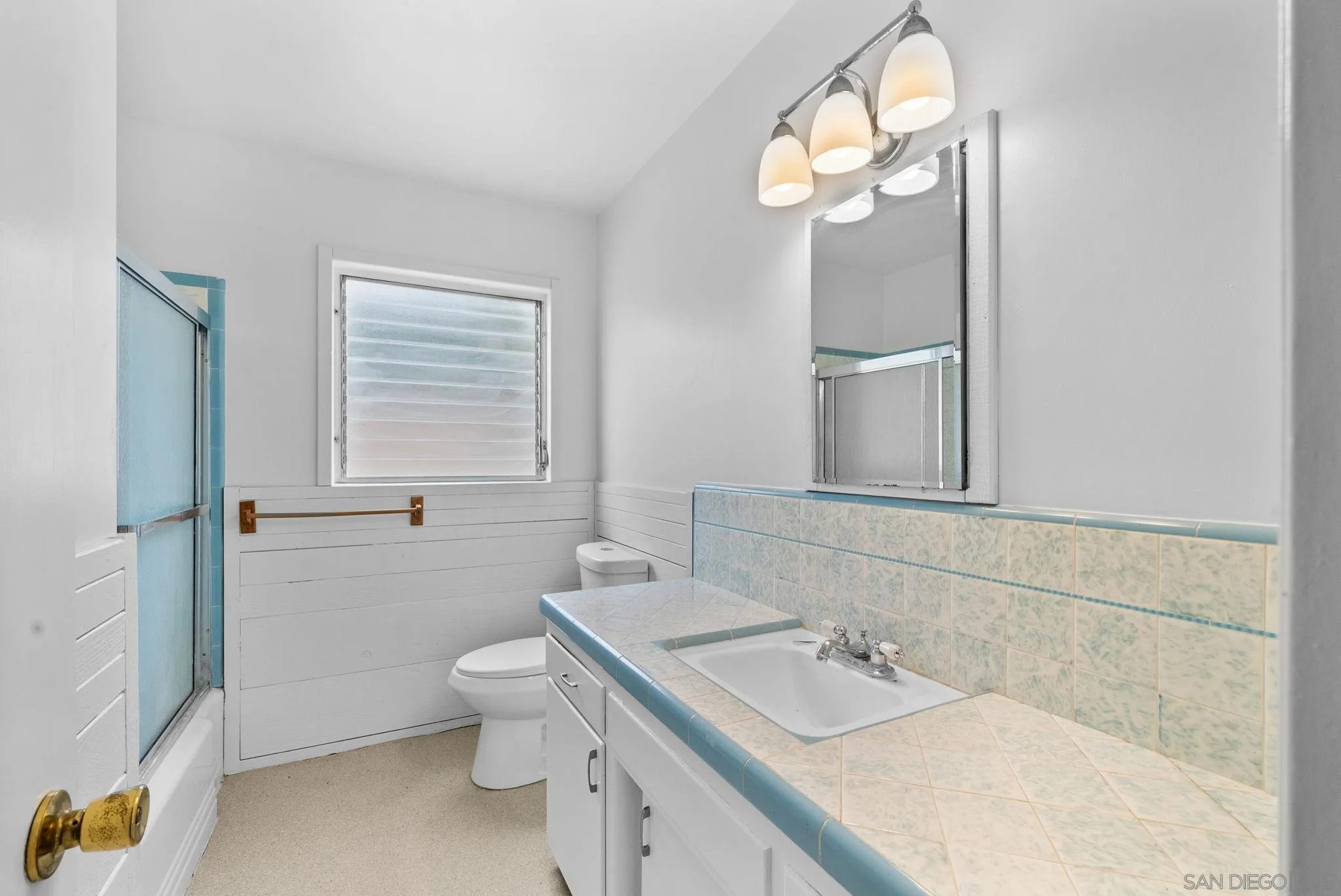 11507 Pinehurst Drive Lakeside, CA 92040 - Photo 17 of 25 a bathroom with a granite countertop sink a toilet and a mirror