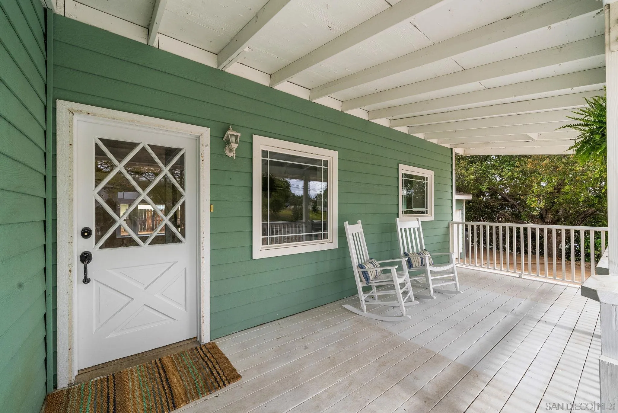 11507 Pinehurst Drive Lakeside, CA 92040 - Photo 7 of 25 a balcony with table and chairs and wooden floor