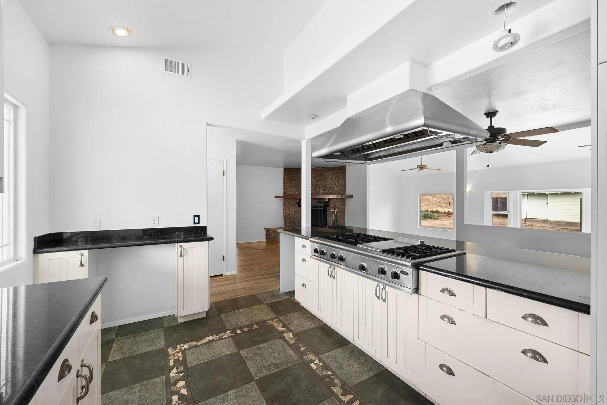 11507 Pinehurst Drive Lakeside, CA 92040 - Photo 9 of 25 a kitchen with granite countertop a sink appliances and cabinets