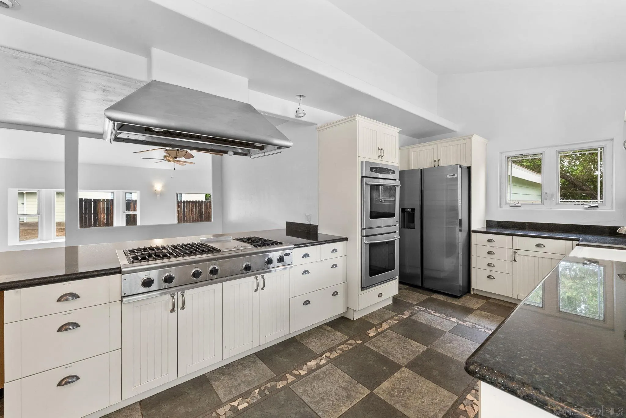 11507 Pinehurst Drive Lakeside, CA 92040 - Photo 10 of 25 a kitchen with granite countertop a stove oven and refrigerator