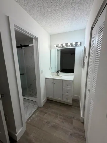 a bathroom with a double vanity sink and mirror