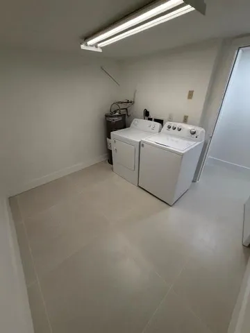 a utility room with washer and dryer
