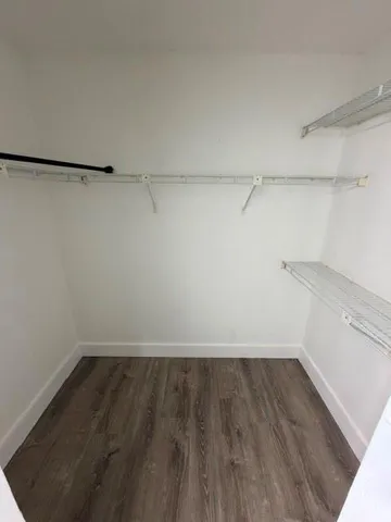 a view of a room with racks on the wall