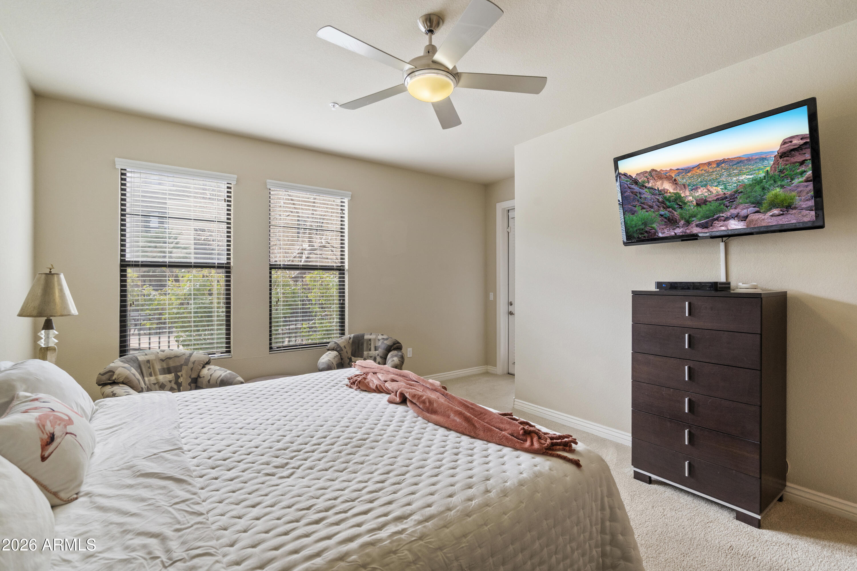 7601 East Indian Bend Road, Unit 1012 Scottsdale, AZ 85250 - Photo 14 of 27 a bedroom with a bed and a flat screen tv