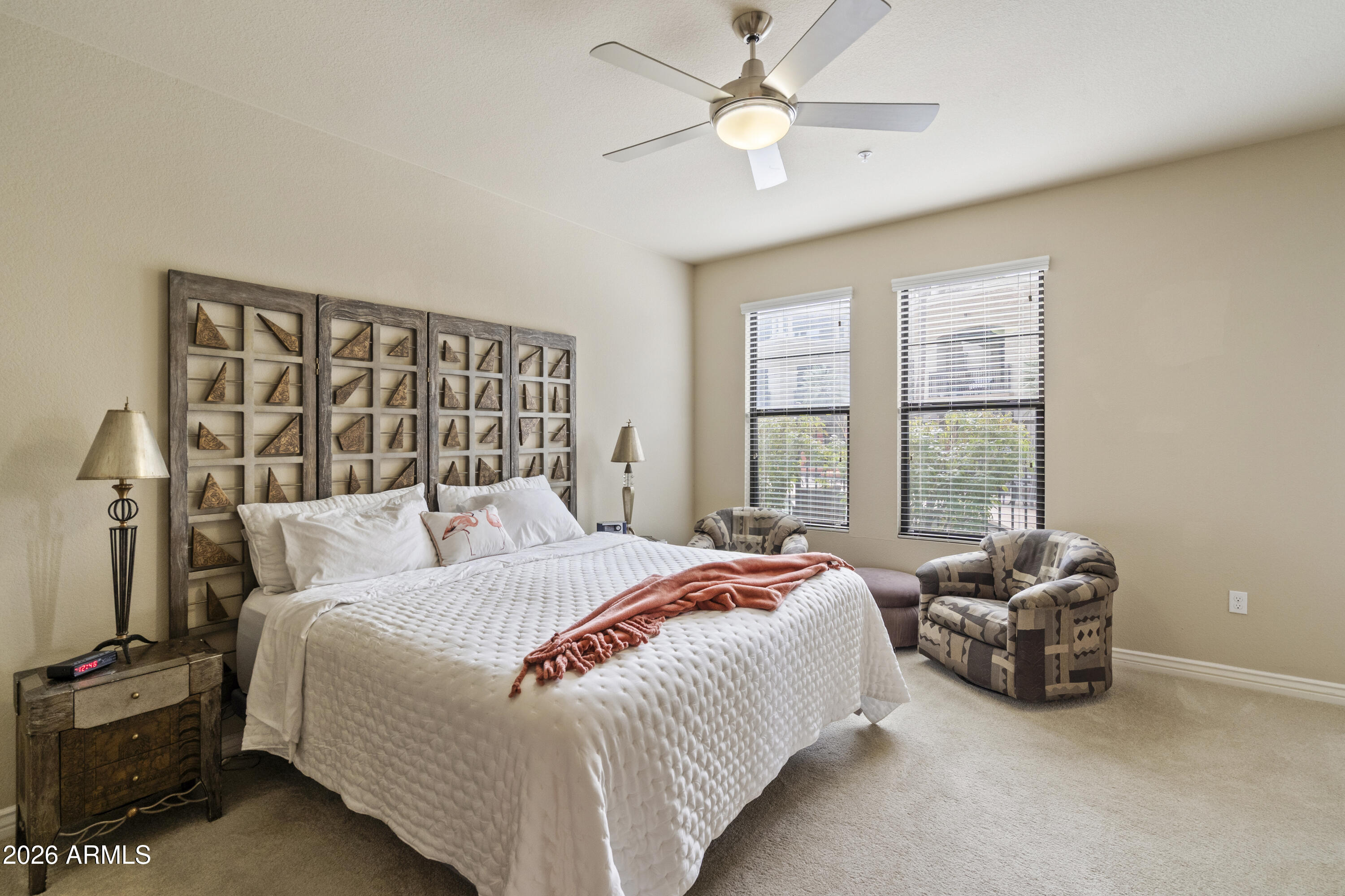 7601 East Indian Bend Road, Unit 1012 Scottsdale, AZ 85250 - Photo 15 of 27 a bedroom with a bed and a large window