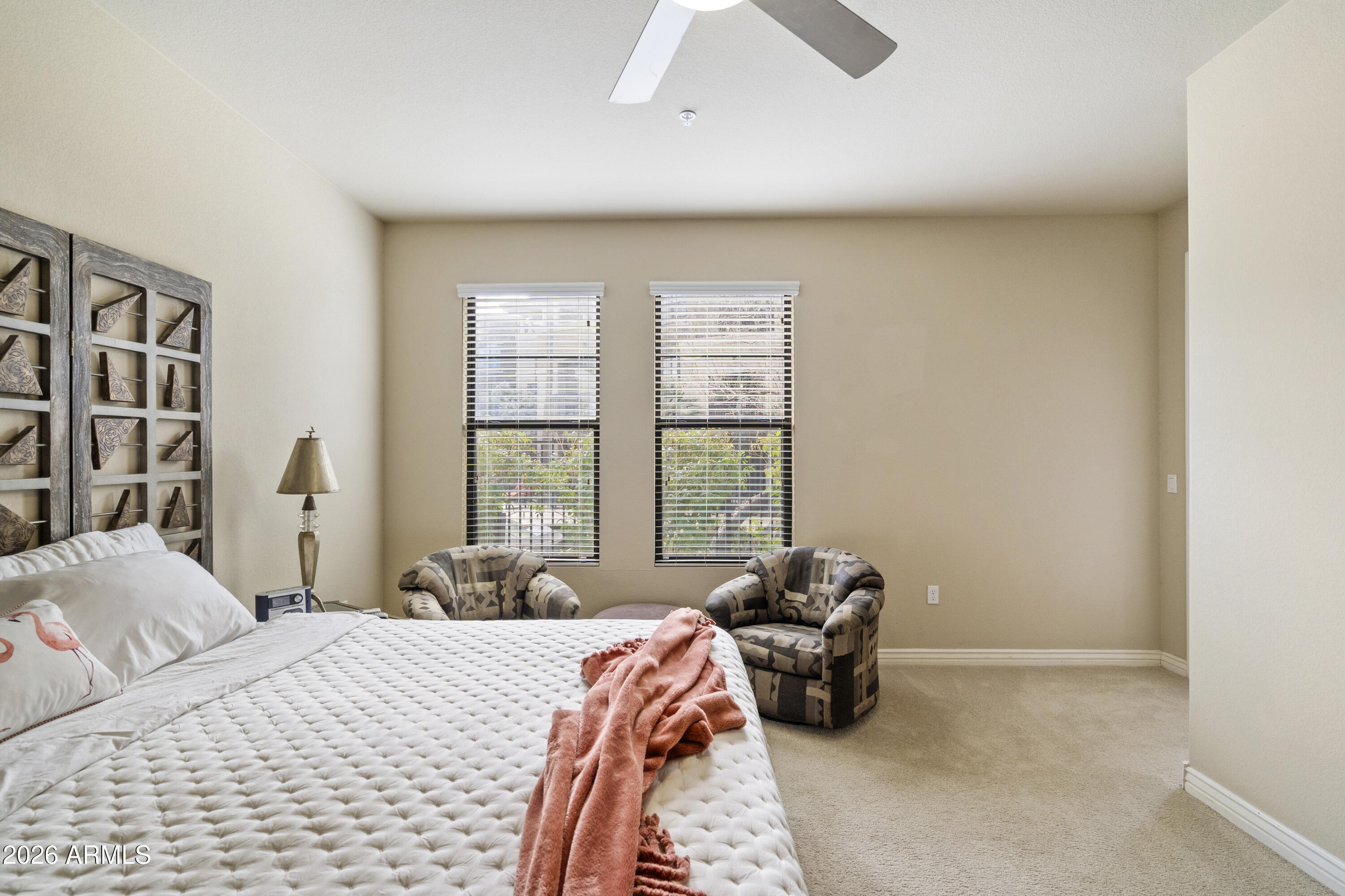7601 East Indian Bend Road, Unit 1012 Scottsdale, AZ 85250 - Photo 16 of 27 a bed room with a bed and a couch