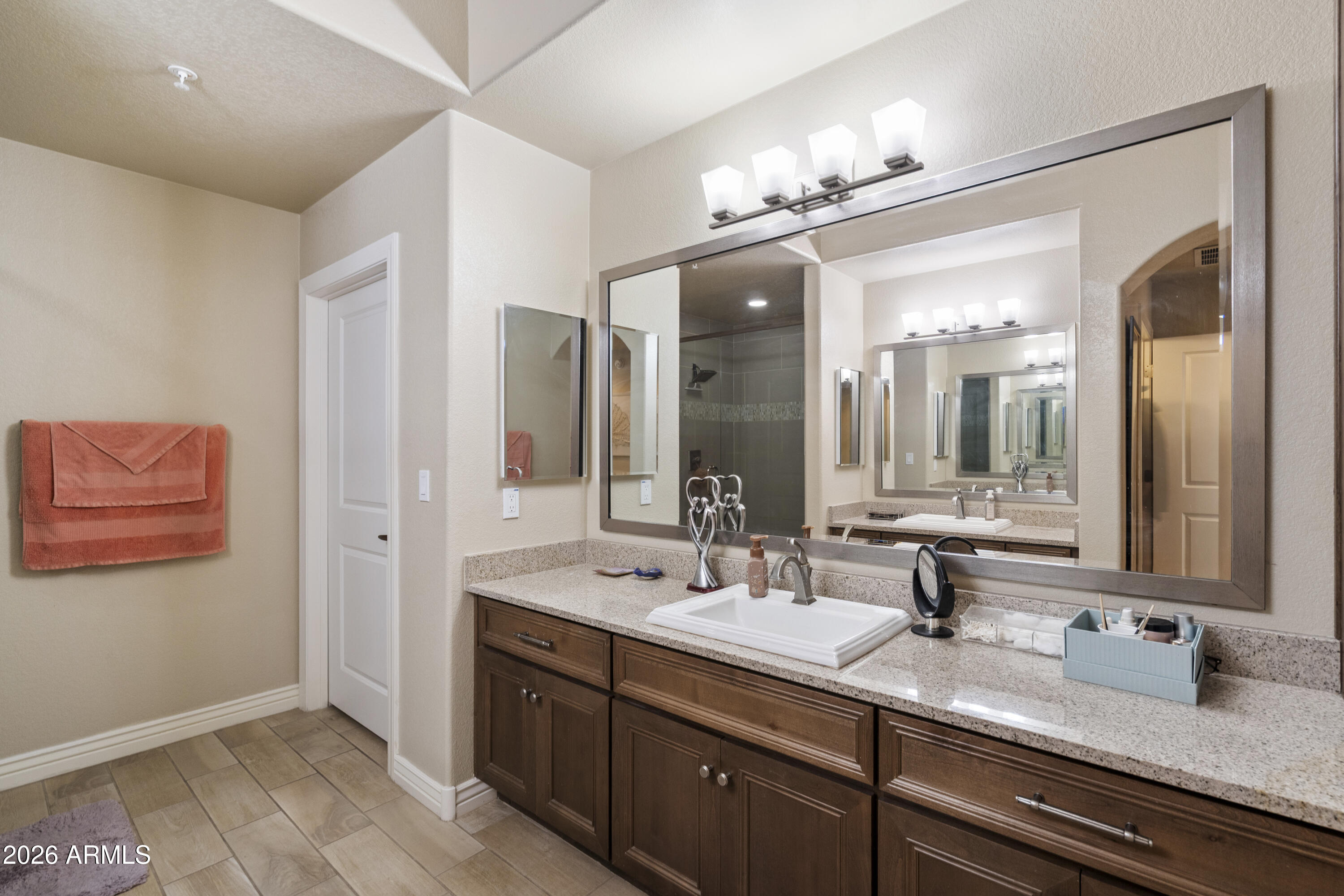 7601 East Indian Bend Road, Unit 1012 Scottsdale, AZ 85250 - Photo 19 of 27 a bathroom with a double vanity sink and a mirror