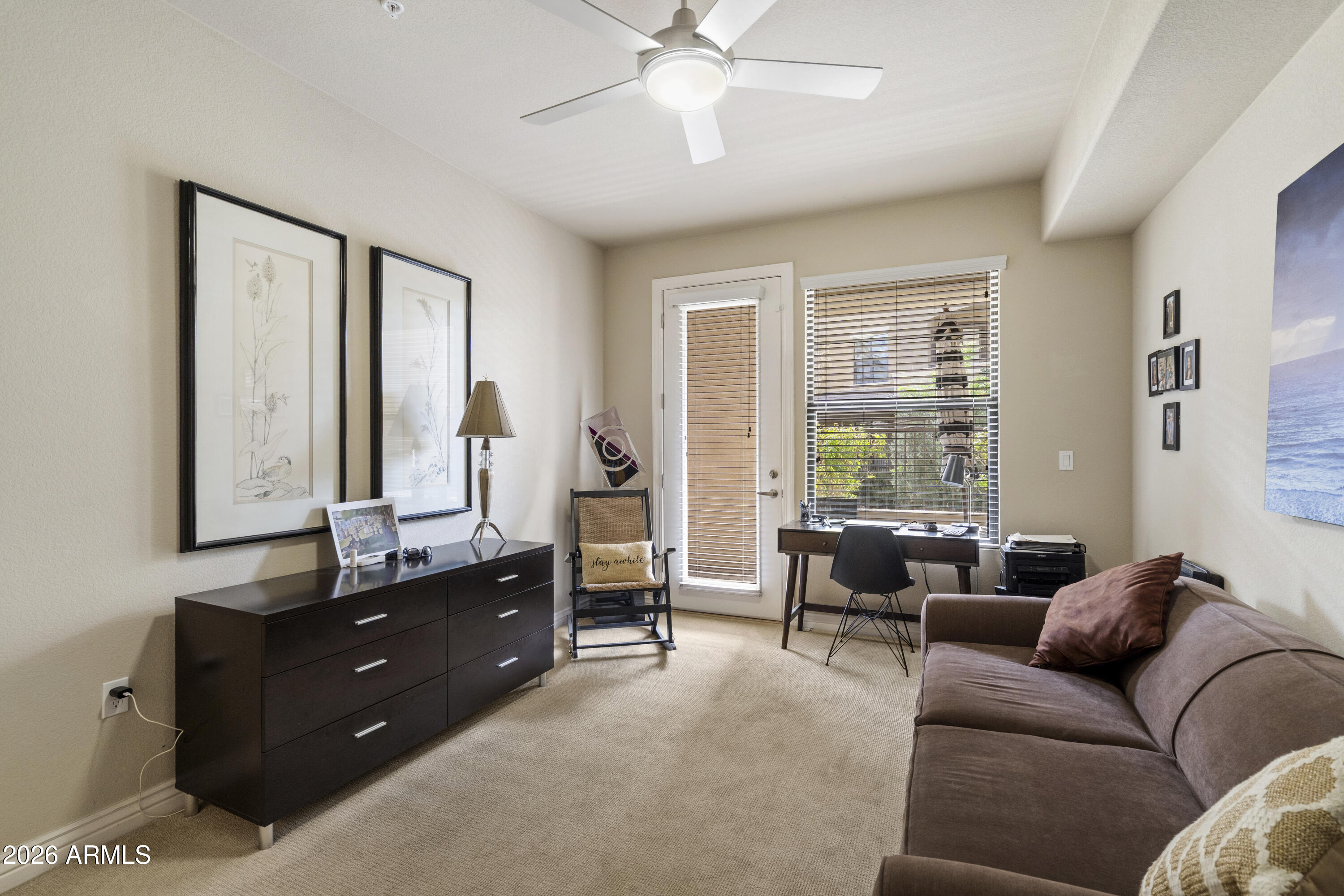 7601 East Indian Bend Road, Unit 1012 Scottsdale, AZ 85250 - Photo 20 of 27 a living room with furniture and windows