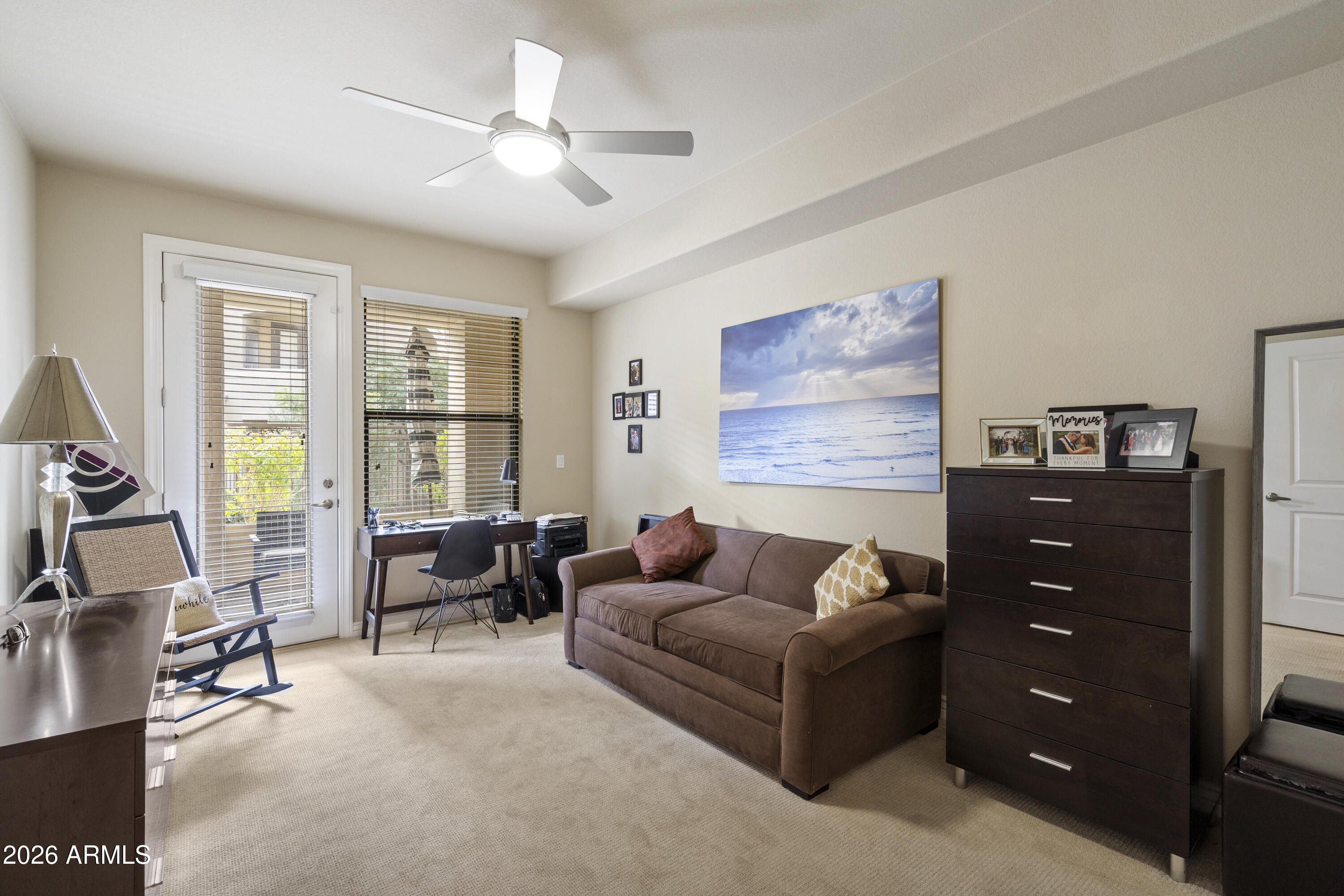 7601 East Indian Bend Road, Unit 1012 Scottsdale, AZ 85250 - Photo 21 of 27 a living room with furniture and a flat screen tv