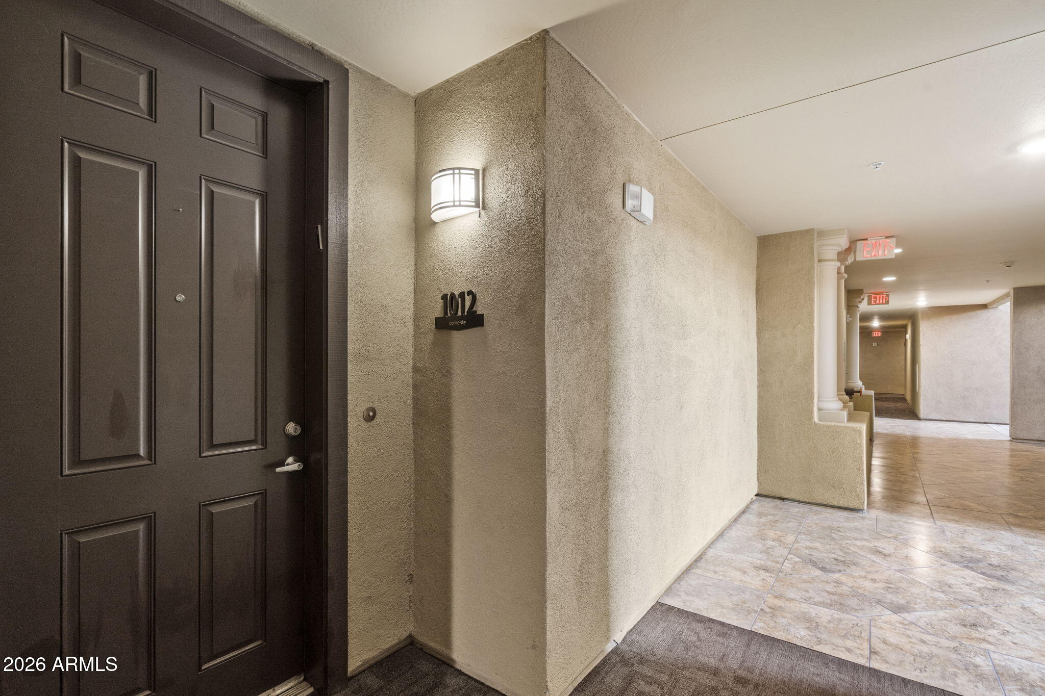7601 East Indian Bend Road, Unit 1012 Scottsdale, AZ 85250 - Photo 25 of 27 a view of a hallway with wooden floor