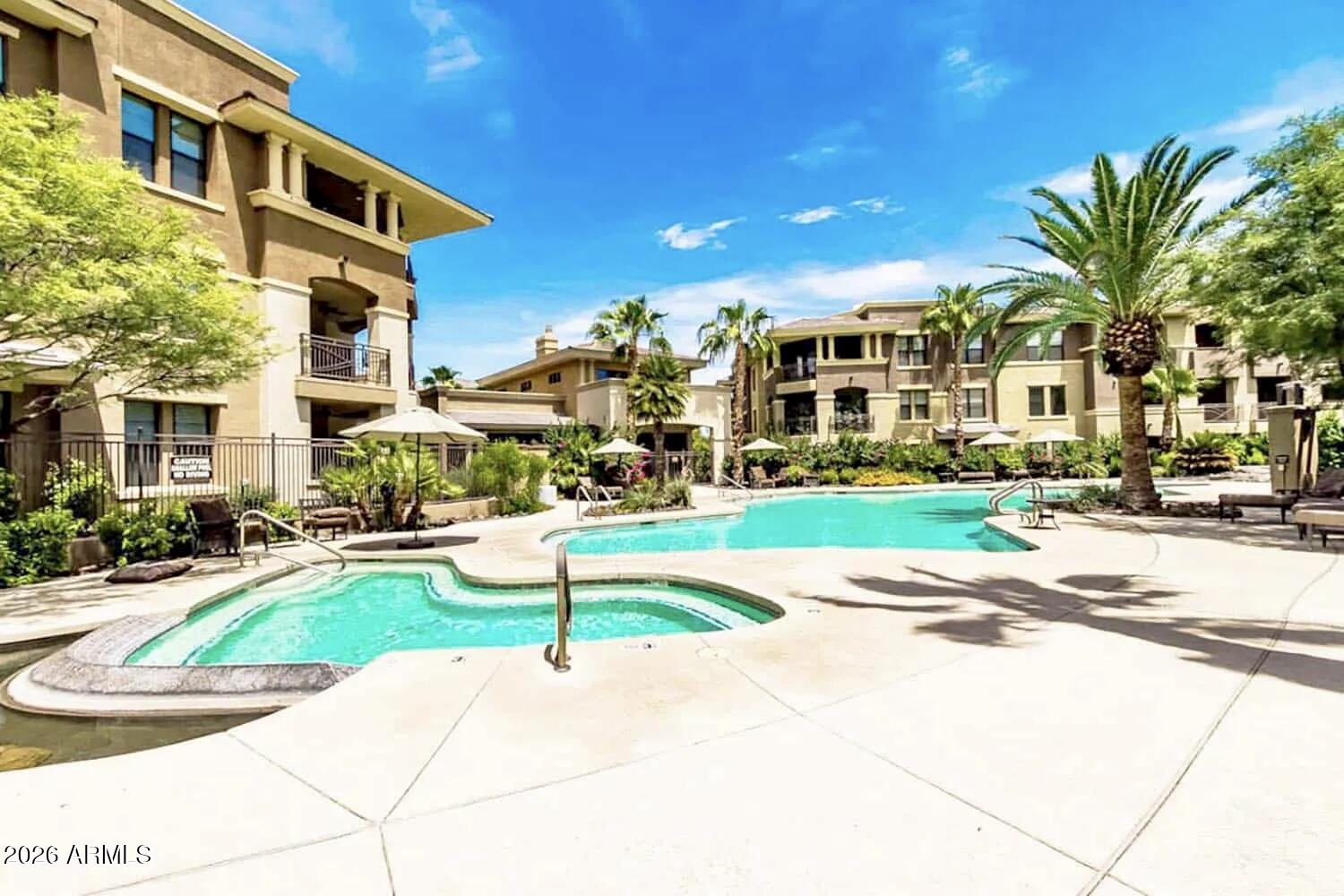 7601 East Indian Bend Road, Unit 1012 Scottsdale, AZ 85250 - Photo 27 of 27 a view of a building with a yard and plants