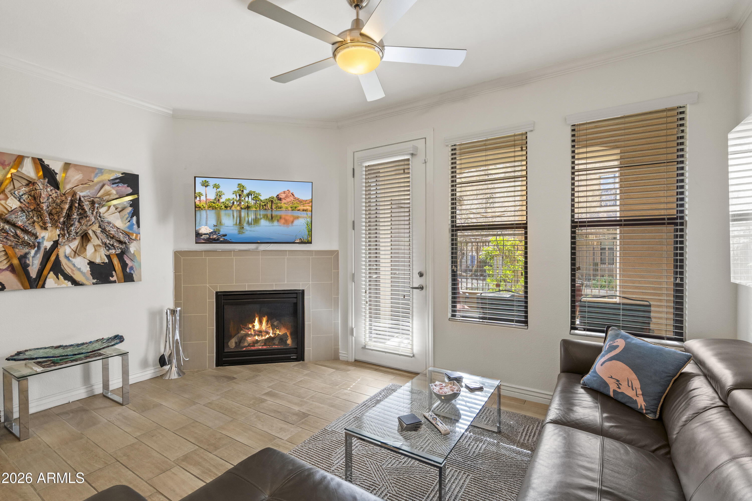 7601 East Indian Bend Road, Unit 1012 Scottsdale, AZ 85250 - Photo 5 of 27 a living room with furniture and a fireplace