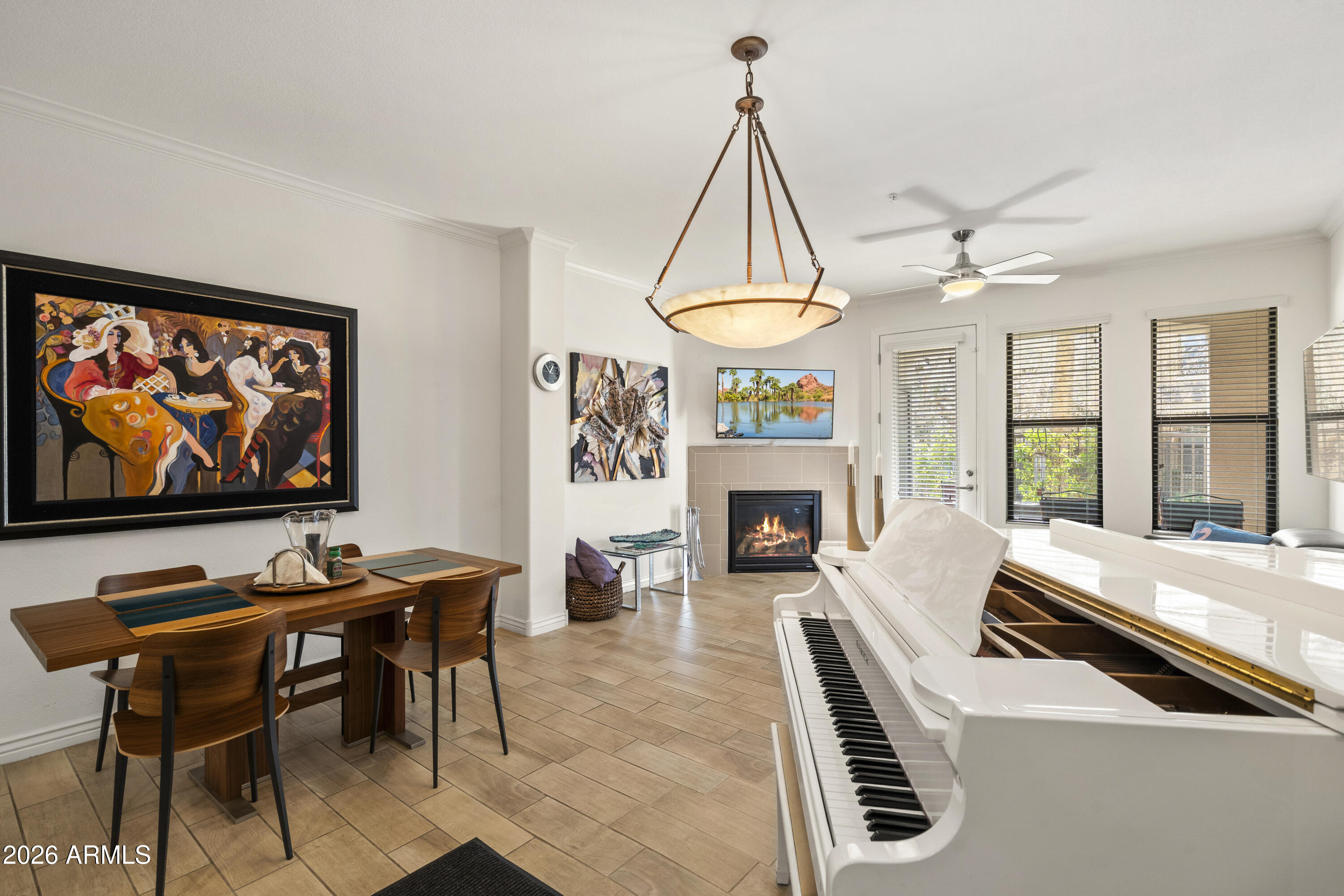 7601 East Indian Bend Road, Unit 1012 Scottsdale, AZ 85250 - Photo 7 of 27 a living room with furniture a table and a fireplace
