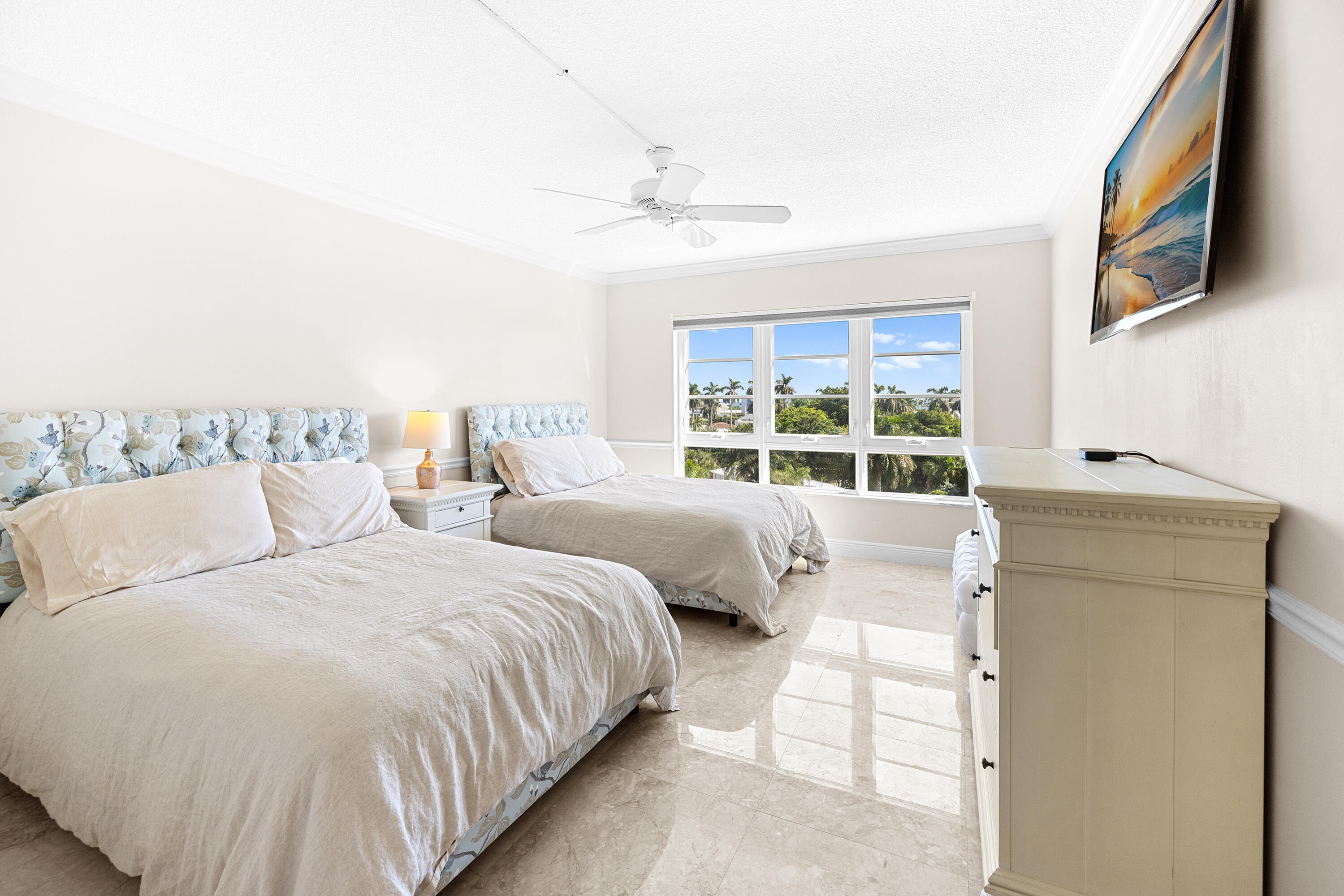 50 E Road, Unit 6E Delray Beach, FL 33483 - Photo 12 of 36 a bedroom with two beds and a large window