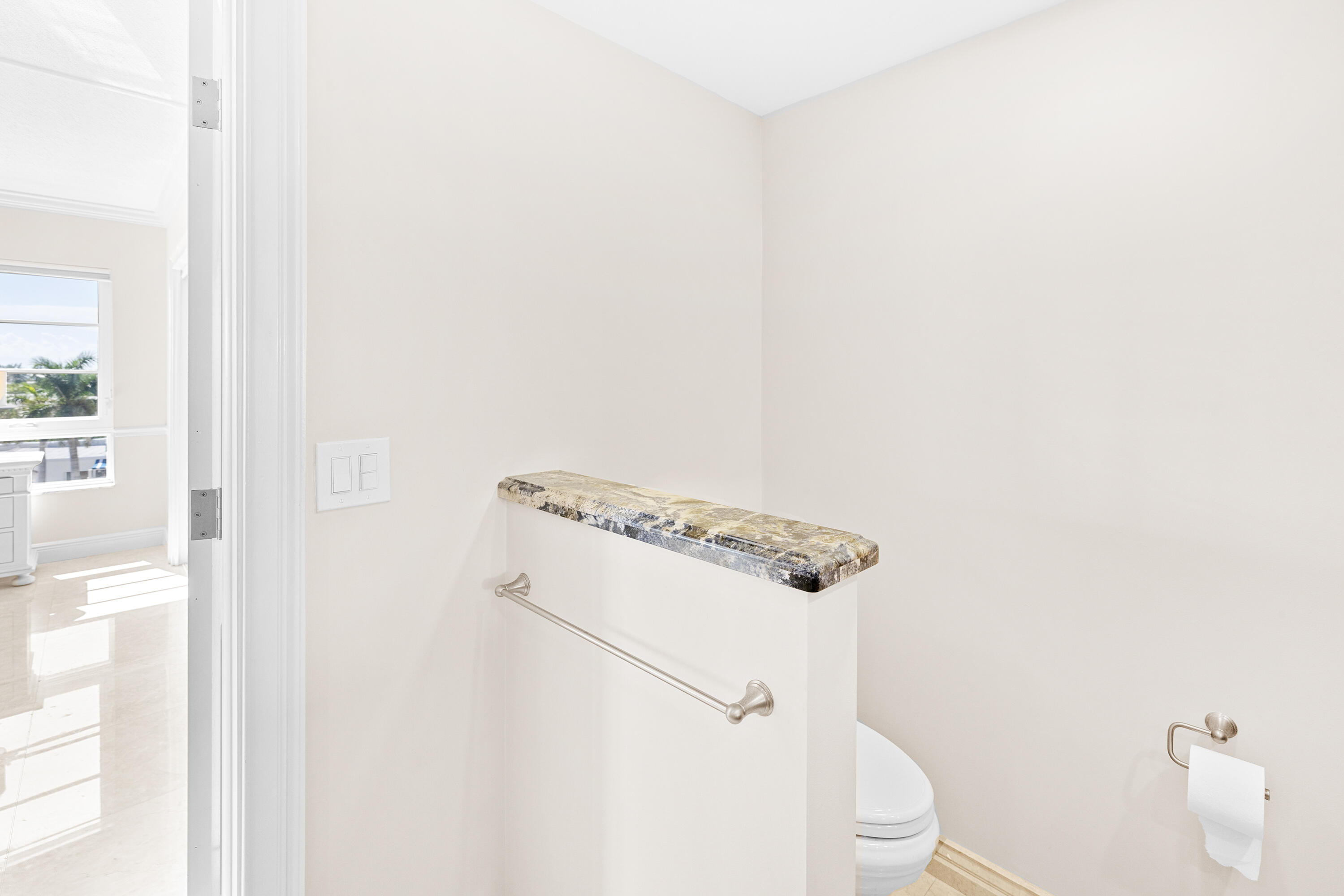 50 E Road, Unit 6E Delray Beach, FL 33483 - Photo 20 of 36 a white toilet sitting next to a shower