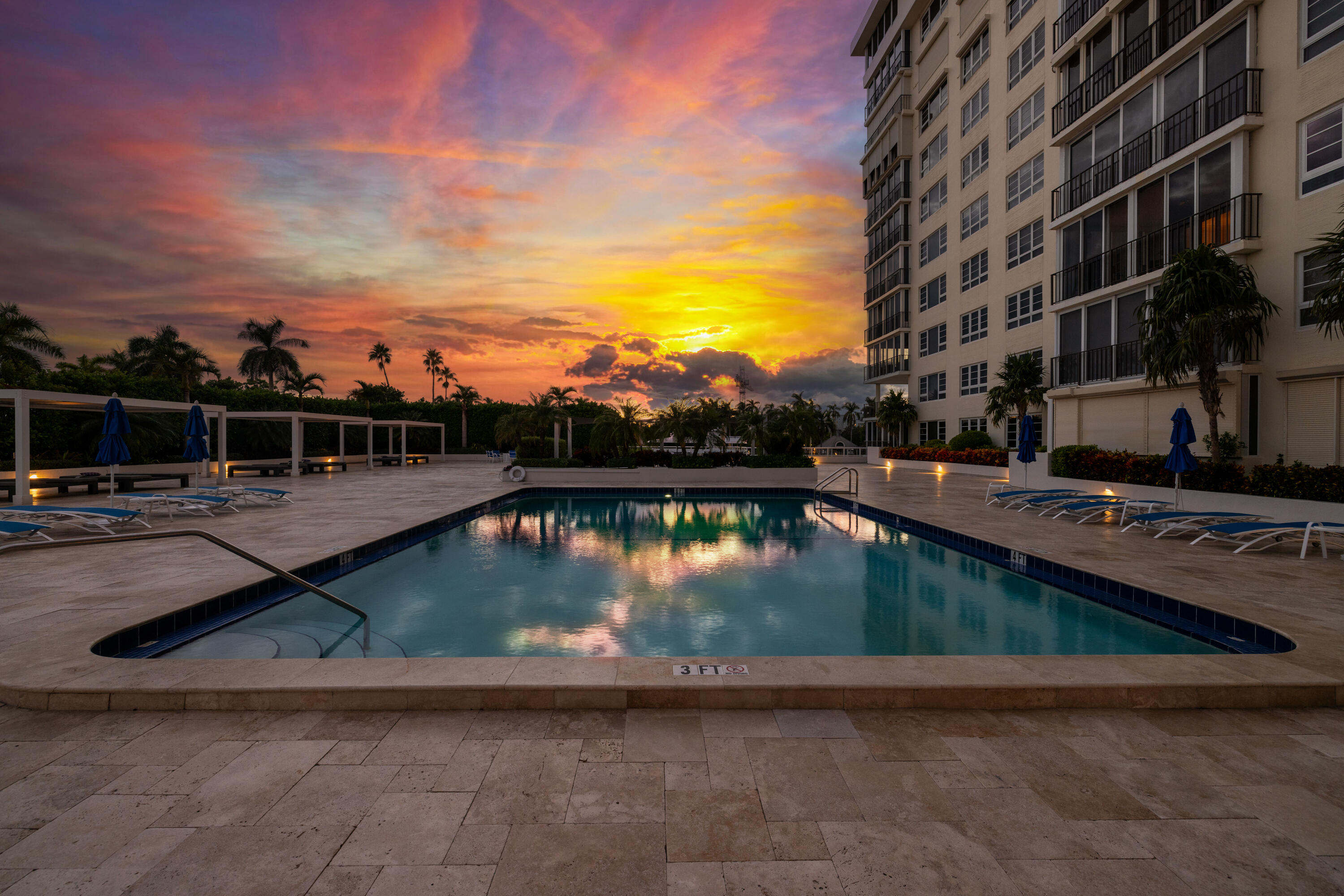 50 E Road, Unit 6E Delray Beach, FL 33483 - Photo 26 of 36 a view of swimming pool with outdoor seating and lake in the back