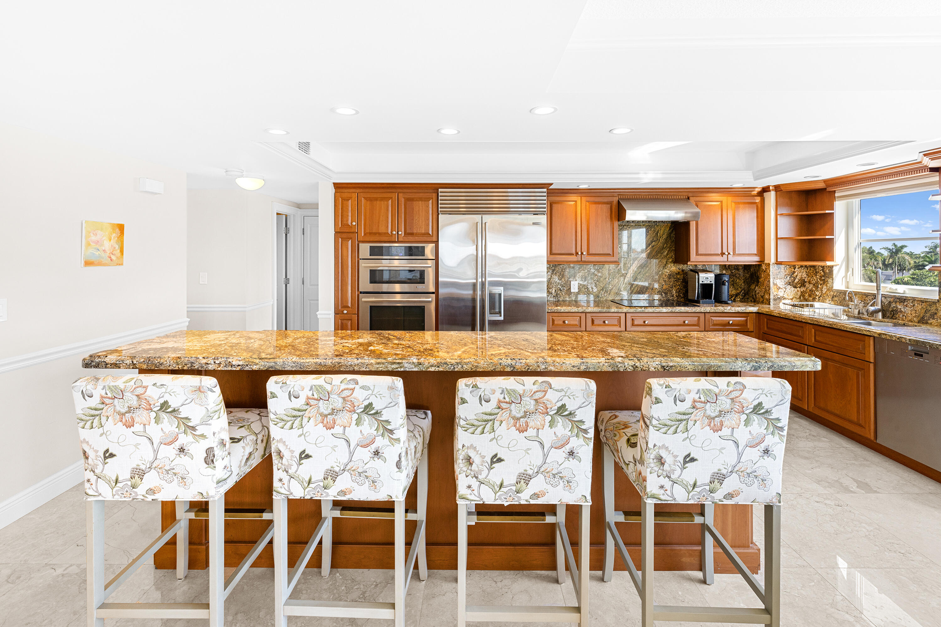 50 E Road, Unit 6E Delray Beach, FL 33483 - Photo 9 of 36 a view of a dining room with furniture and wooden floor