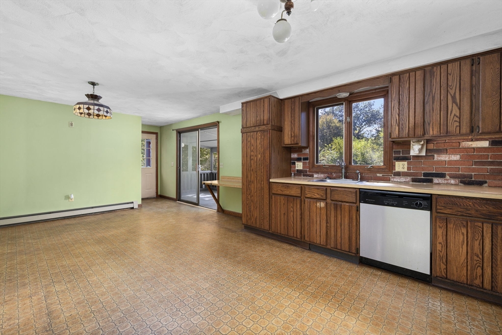 40 Union Street Blackstone, MA 01504 - Photo 17 of 40 a large kitchen with a sink and cabinets