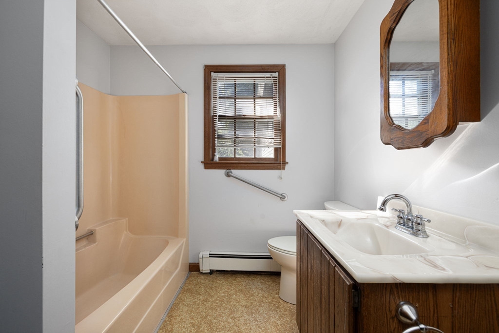 40 Union Street Blackstone, MA 01504 - Photo 18 of 40 a bathroom with a sink and a bathtub