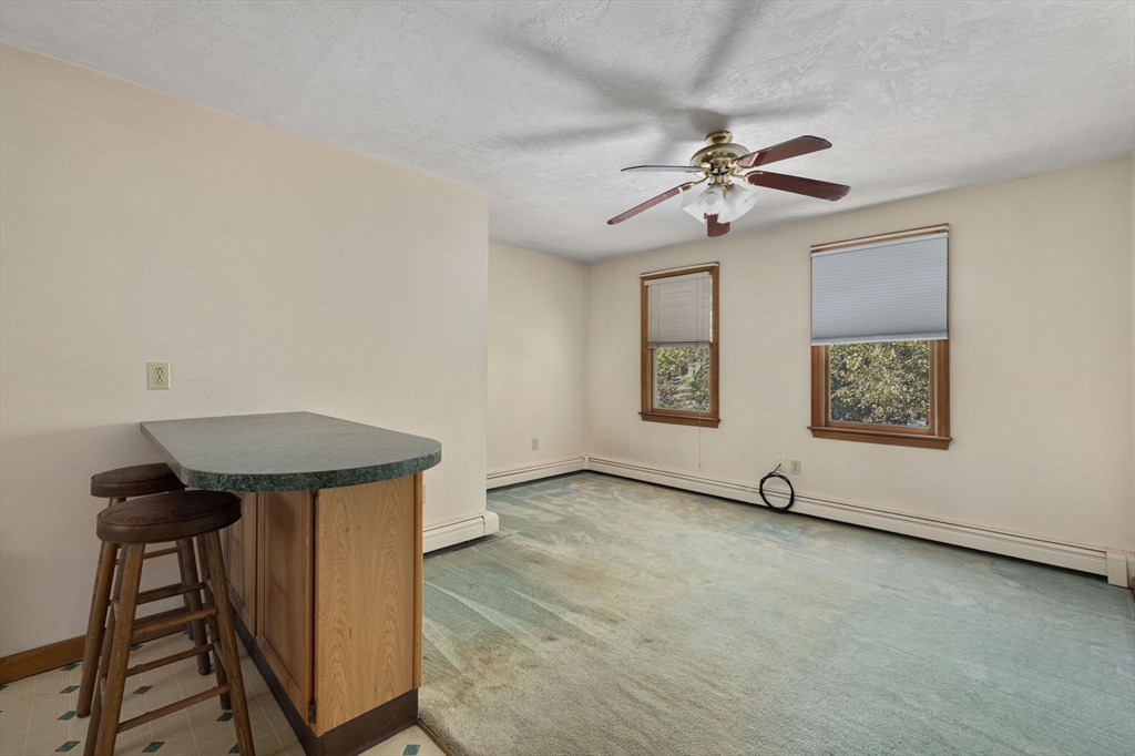 40 Union Street Blackstone, MA 01504 - Photo 34 of 40 an empty room with windows and fan