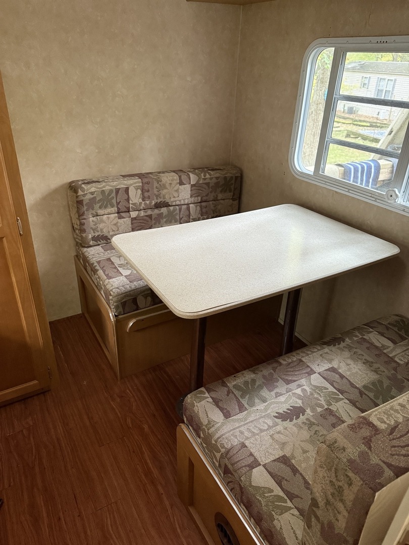 1-108 Woodhaven Lakes Sublette, IL 61367 - Photo 17 of 17 a bed sitting in a bedroom next to a window