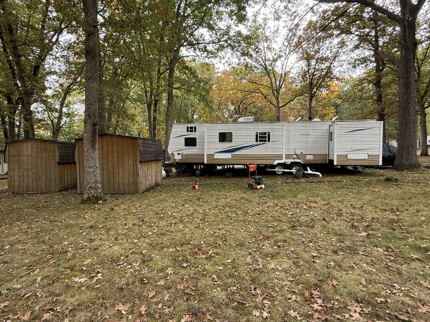 1-108 Woodhaven Lakes Sublette, IL 61367 - Photo 6 of 17 a backyard of a house with barbeque oven and trees