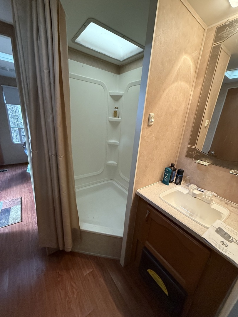 1-108 Woodhaven Lakes Sublette, IL 61367 - Photo 9 of 17 a bathroom with a sink a mirror and a shower
