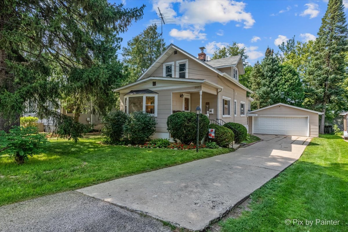 302 Circle Road Fox River Grove, IL 60021 - Photo 1 of 35 a front view of a house with a yard