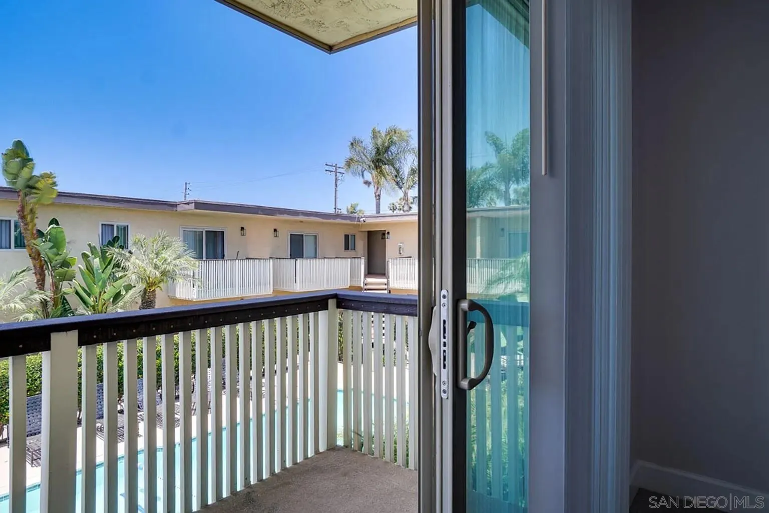 600 F Street Chula Vista, CA 91910 - Photo 11 of 12 a view of a porch with a floor to ceiling window and wooden floor