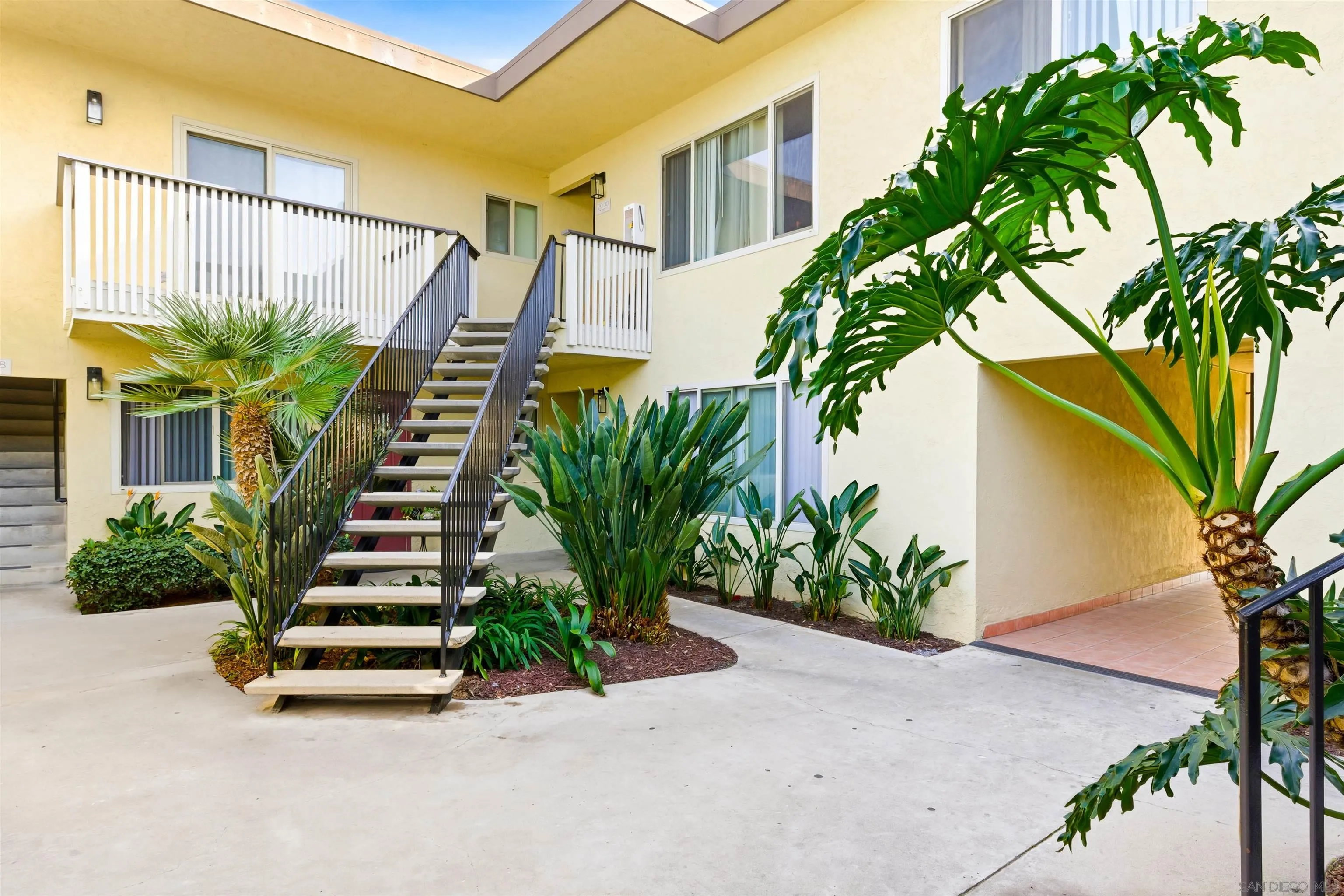 600 F Street Chula Vista, CA 91910 - Photo 4 of 12 a potted plant sitting in front of a house