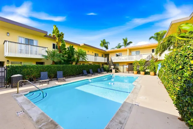 a kitchen with a sink cabinets and appliances