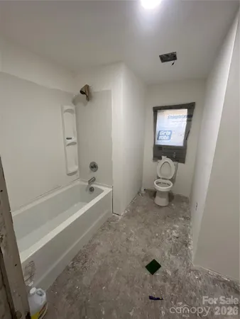 a bathroom with a sink a toilet and bathtub
