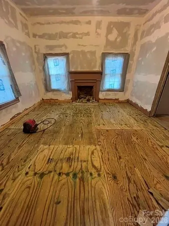 a bedroom with a bed and a fireplace