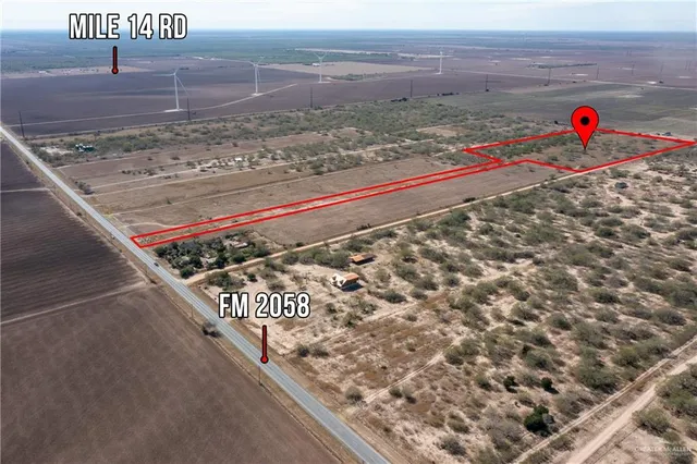 a view of a area with wooden fence