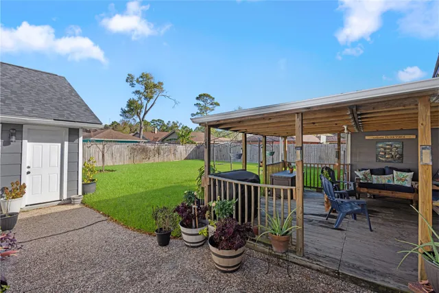 a view of a patio with a table and chairs