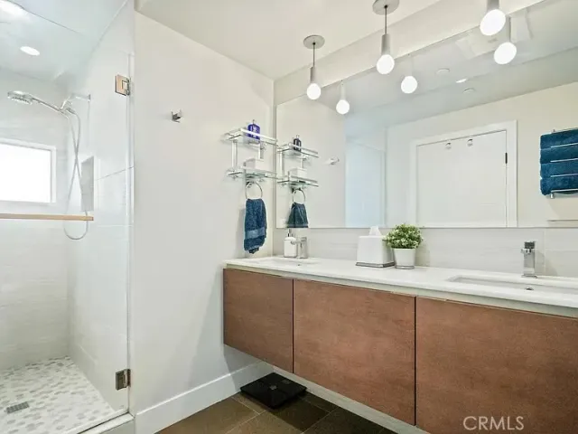 a kitchen with kitchen island a sink stainless steel appliances and cabinets