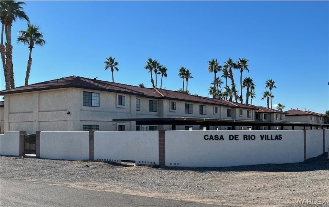 1190 Ramar Road, Unit 27 Bullhead City, AZ 86442 - Photo 1 of 15 a view of a house with a balcony