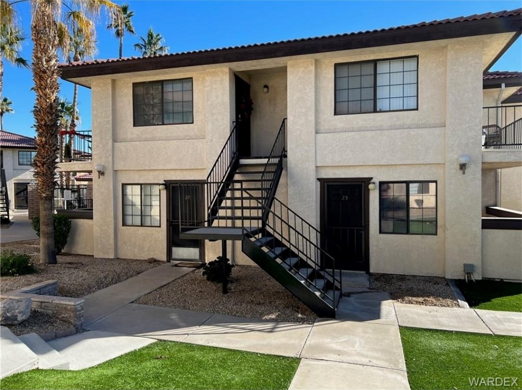 1190 Ramar Road, Unit 27 Bullhead City, AZ 86442 - Photo 2 of 15 a view of a house with backyard porch and sitting area