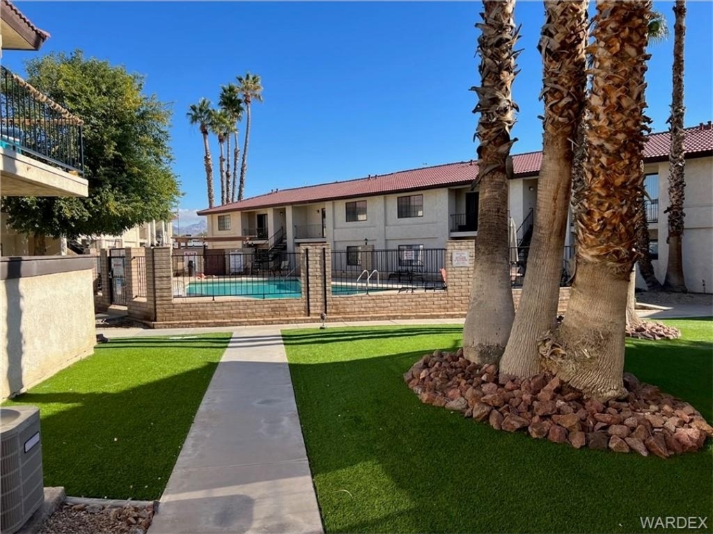 1190 Ramar Road, Unit 27 Bullhead City, AZ 86442 - Photo 3 of 15 a view of a house with backyard and garden