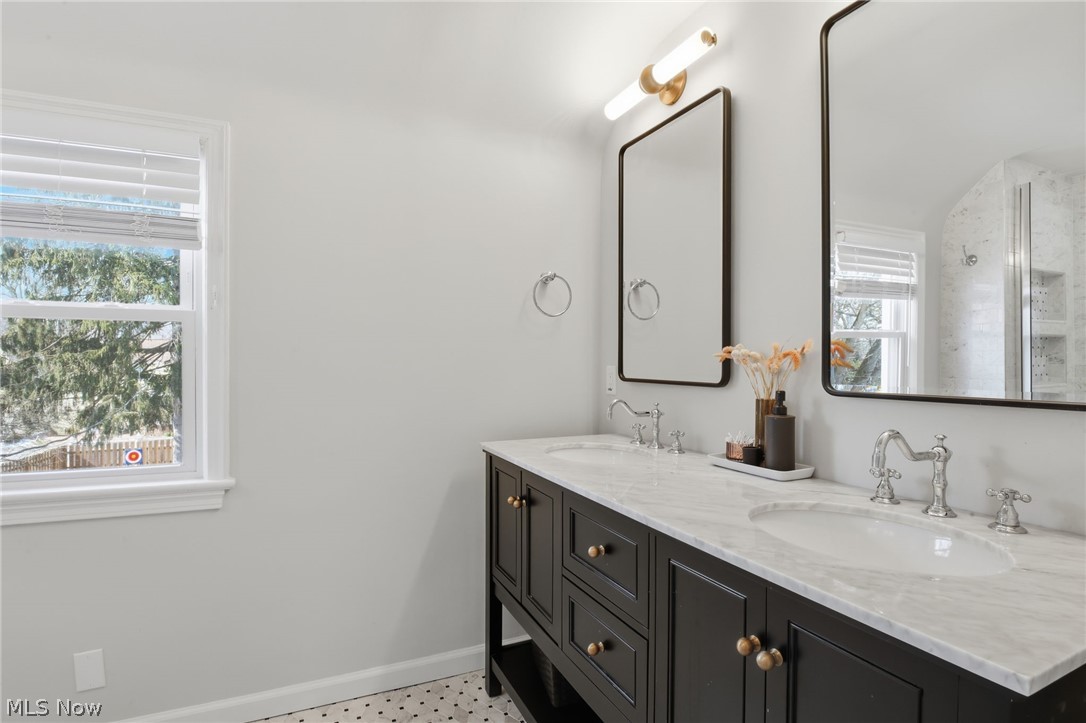 1390 Brainard Road Lyndhurst, OH 44124 - Photo 22 of 33 Full bathroom featuring double vanity, light floors, and plenty of natural light